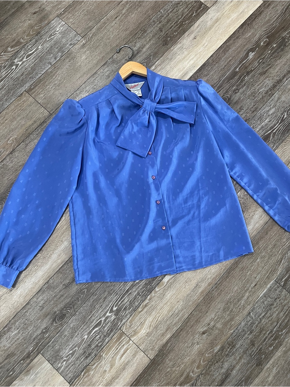 The Wyndham Collection vintage blue long-sleeve blouse featuring a large matchin